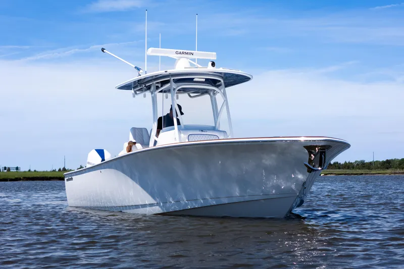 Slide: The Image of Valhalla Boatworks V-29 Hybrid 2027 on calm water under clear sky. - 4