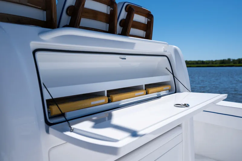 Slide: The Image of 2027 Valhalla Boatworks V-29 Hybrid storage compartment open on a sunny day by the water. - 40