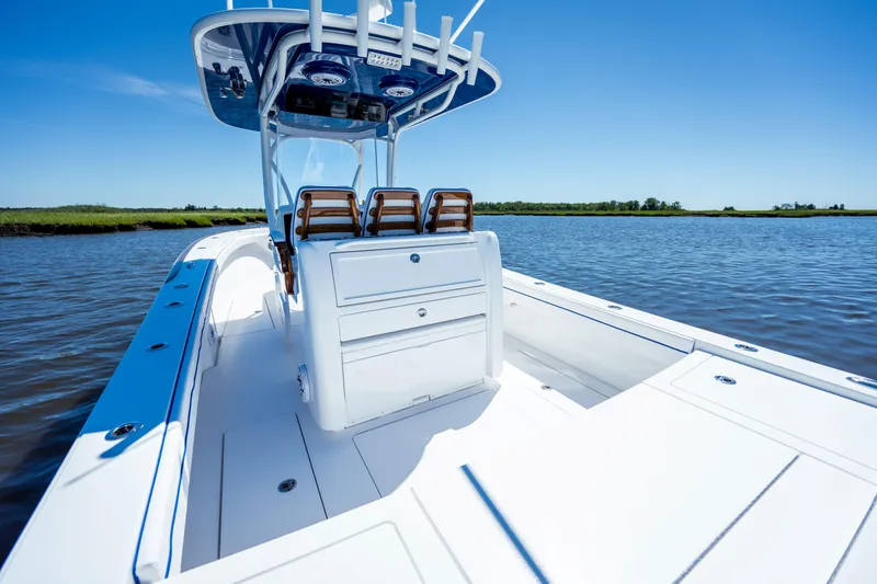 Slide: The Image of 2027 Valhalla Boatworks V-29 Hybrid on calm water, showcasing sleek design and spacious deck. - 41