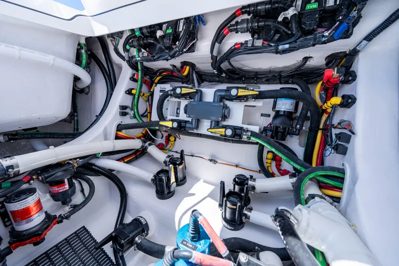 Slide: The Image of Engine compartment of 2027 Valhalla Boatworks V-29 Hybrid, showcasing intricate wiring and components. - 44