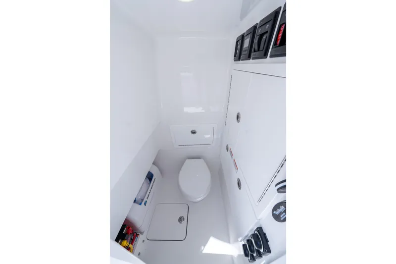 Slide: The Image of Interior of 2027 Valhalla Boatworks V-29 Hybrid, featuring a compact marine toilet. - 45