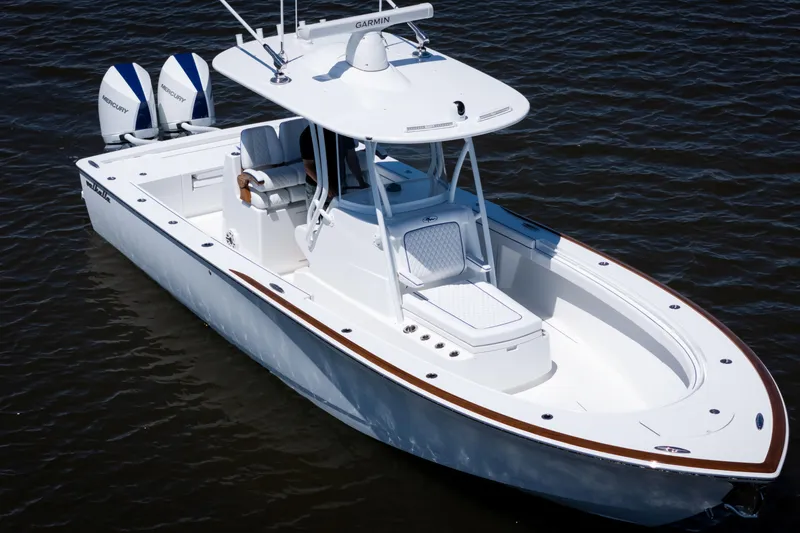 Slide: The Image of 2027 Valhalla Boatworks V-29 Hybrid on water, featuring sleek design and dual Mercury engines. - 5