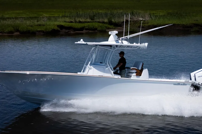 Slide: The Image of 2027 Valhalla Boatworks V-29 Hybrid cruising on water, showcasing sleek design and performance. - 9