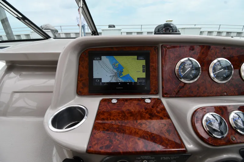 Slide: The Image of Dashboard of a 2004 Formula 330 Sun Sport boat with navigation display and gauges. - 11