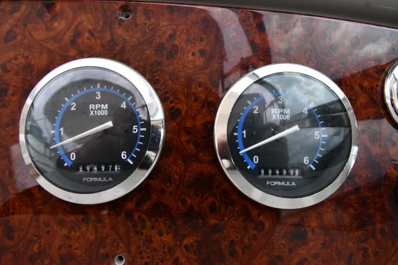 Slide: The Image of Dashboard of a 2004 Formula 330 Sun Sport with RPM gauges. - 14