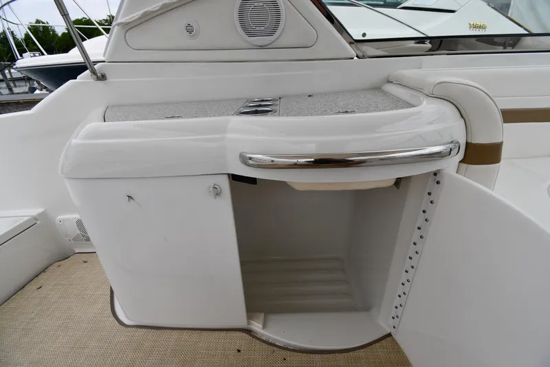 Slide: The Image of 2004 Formula 330 Sun Sport boat interior storage compartment with open door. - 21