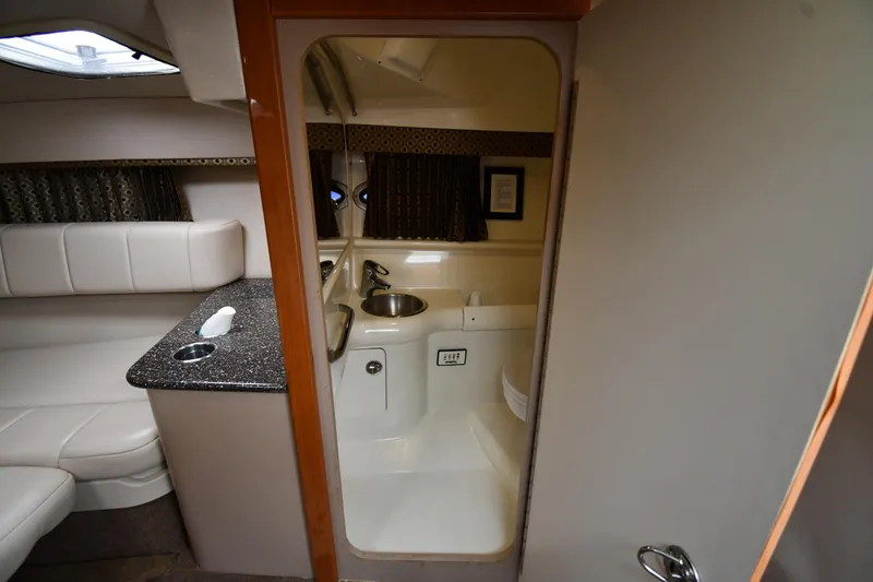 Slide: The Image of 2004 Formula 330 Sun Sport cabin interior with kitchenette and seating area. - 33