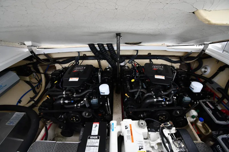 Slide: The Image of Engine compartment of a 2004 Formula 330 Sun Sport boat, featuring dual engines. - 39