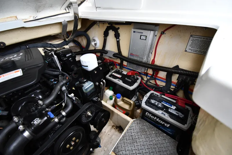 Slide: The Image of Engine compartment of a 2004 Formula 330 Sun Sport boat with batteries and wiring. - 40