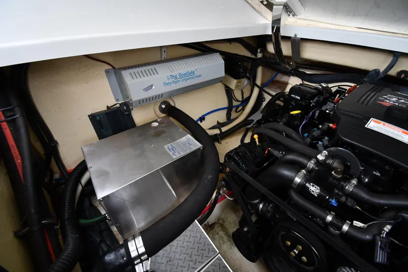 Slide: The Image of Engine compartment of a 2004 Formula 330 Sun Sport boat, showcasing mechanical components. - 41