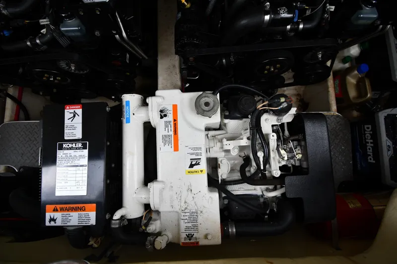 Slide: The Image of Engine compartment of a 2004 Formula 330 Sun Sport boat with Kohler generator. - 42