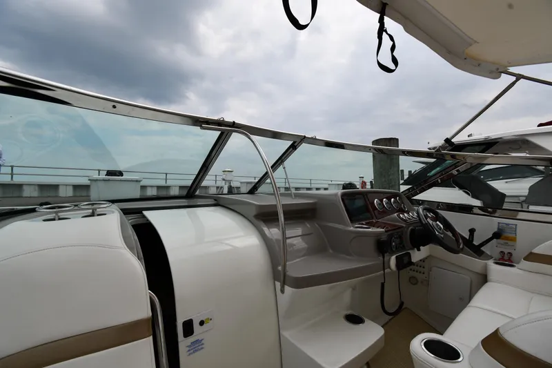 Slide: The Image of Interior view of 2004 Formula 330 Sun Sport boat cockpit with steering wheel and dashboard. - 9