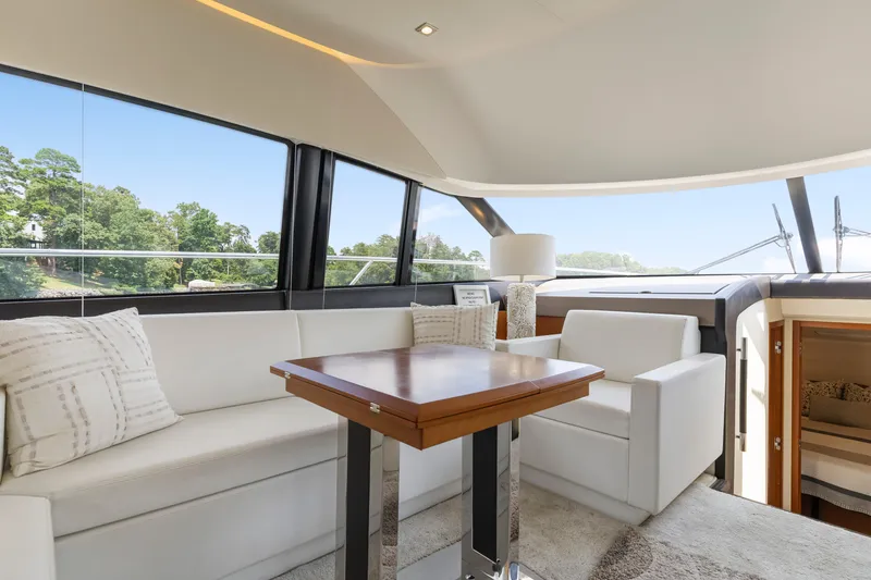 Slide: The Image of Luxurious interior of a 2017 Prestige 500 yacht with elegant seating and panoramic windows. - 12