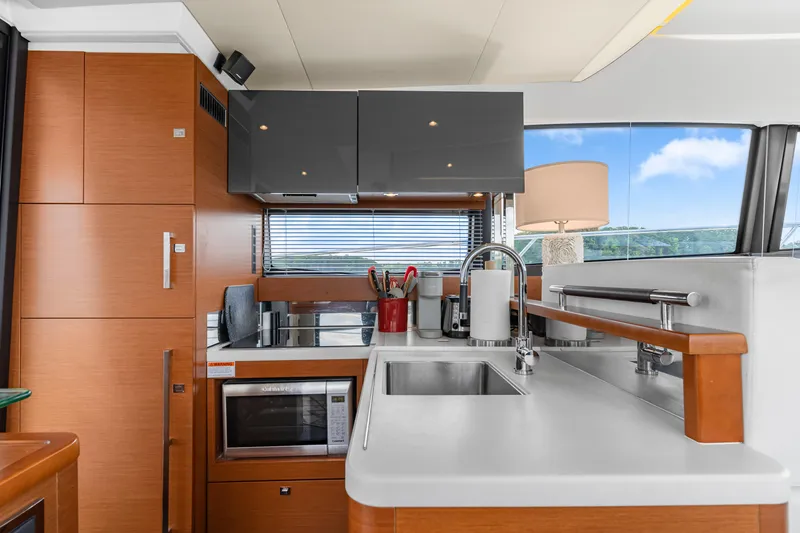 Slide: The Image of Modern kitchen interior on a 2017 Prestige 500 yacht, featuring sleek cabinetry and appliances. - 18