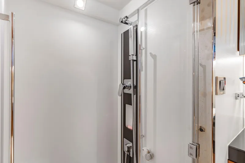 Slide: The Image of Modern shower area in a 2017 Prestige 500 yacht, featuring sleek fixtures and glass door. - 21