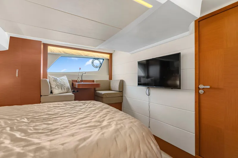 Slide: The Image of Luxurious cabin interior of 2017 Prestige 500 yacht with bed, seating, and TV. - 23
