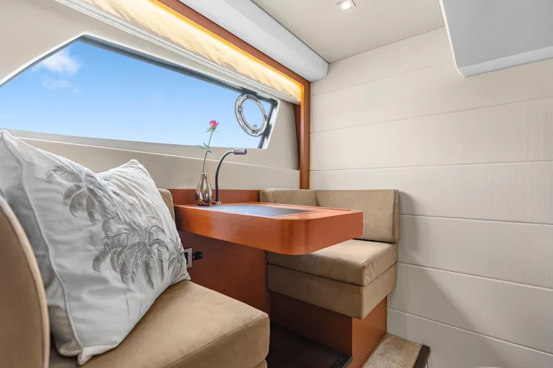 Slide: The Image of Luxurious interior of 2017 Prestige 500 yacht with elegant seating and window view. - 25