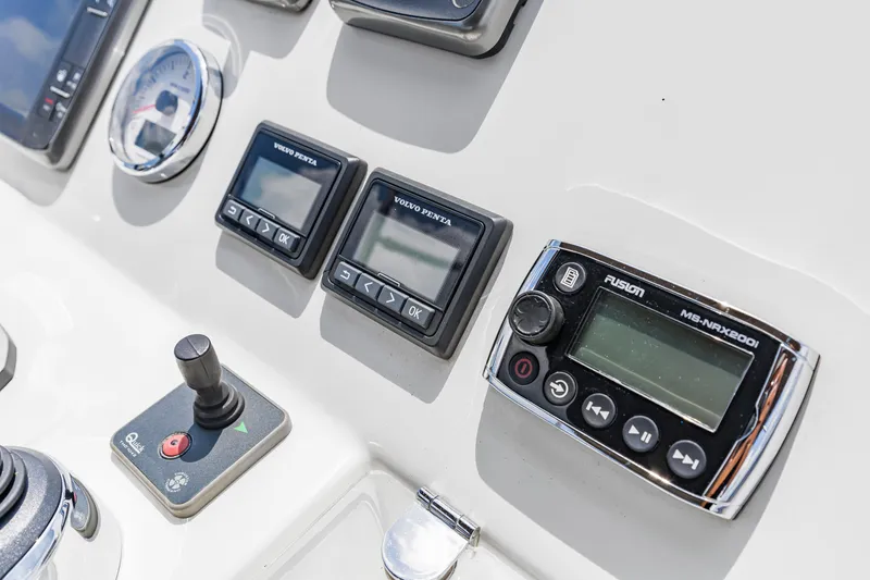 Slide: The Image of Control panel of a 2017 Prestige 500 yacht with various electronic displays. - 37
