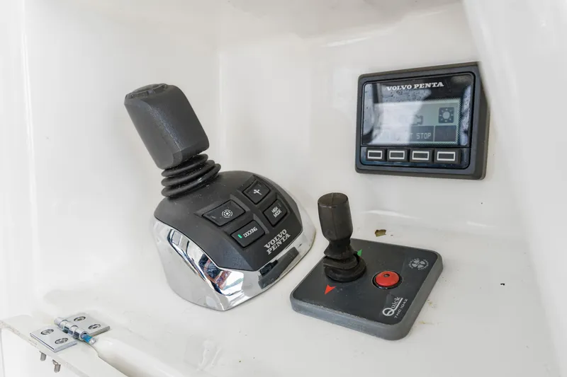 Slide: The Image of Control panel of a 2017 Prestige 500 yacht featuring joystick and Volvo Penta display. - 39