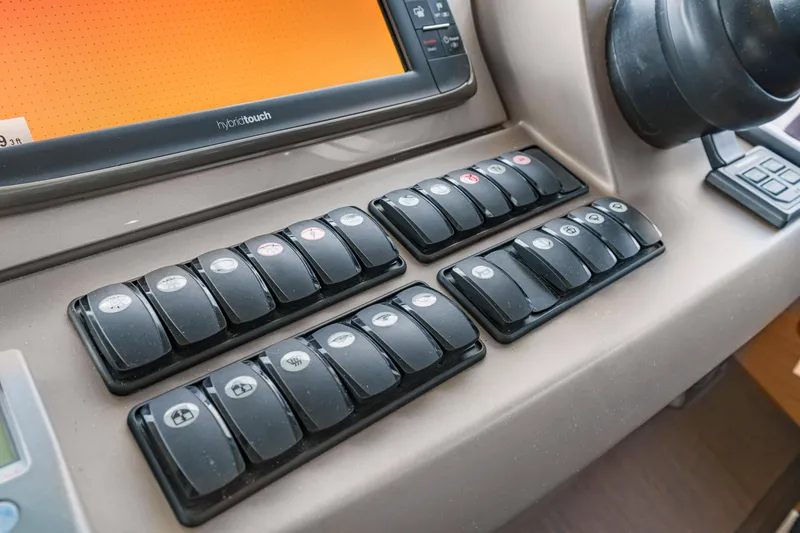 Slide: The Image of Control panel of a 2017 Prestige 500 yacht with multiple switches and touchscreen display. - 43