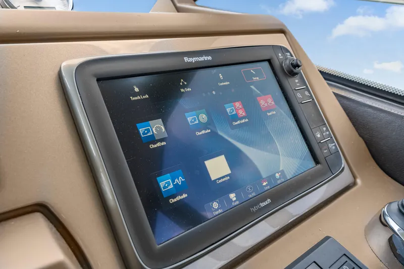 Slide: The Image of Raymarine navigation display on 2017 Prestige 500 yacht dashboard, showing various marine applications. - 48