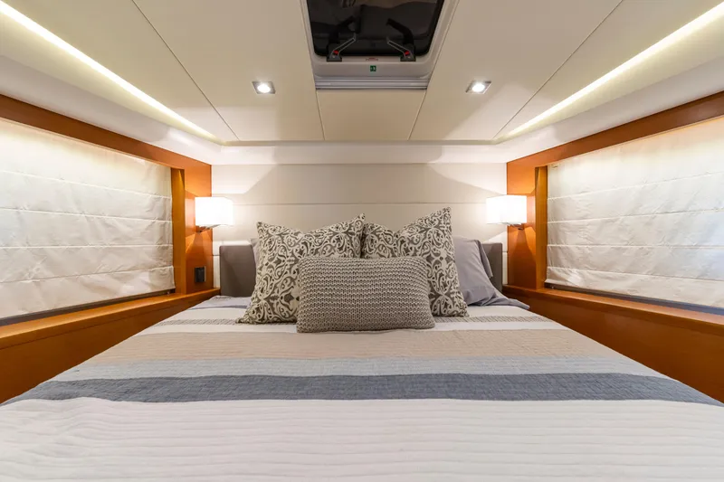 Slide: The Image of Luxurious bedroom interior of 2017 Prestige 500 yacht with elegant bedding and ambient lighting. - 5