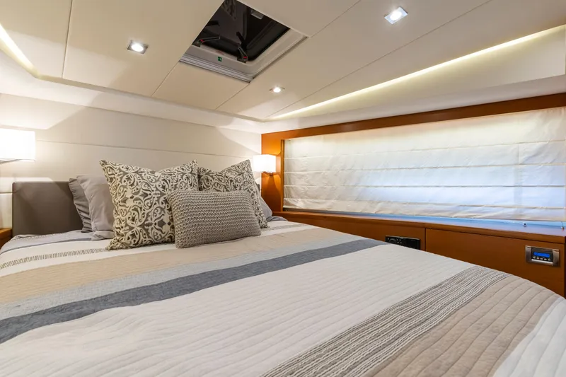 Slide: The Image of Luxurious bedroom interior of 2017 Prestige 500 yacht with elegant bedding and ambient lighting. - 6