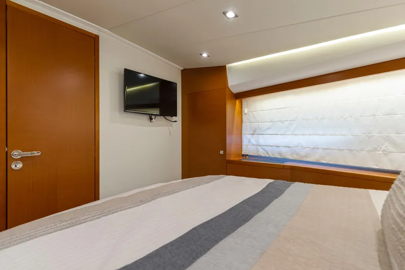 Slide: The Image of Luxurious interior of 2017 Prestige 500 yacht with modern decor and wall-mounted TV. - 7