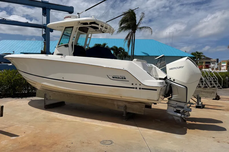 The Image of 2019 Boston Whaler 280 Outrage boat with Mercury engine on display outdoors. - 0