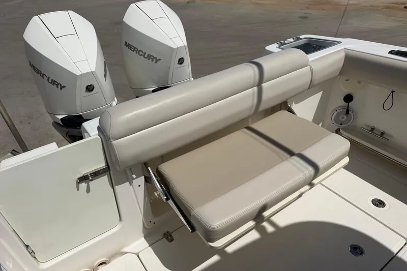 Slide: The Image of 2019 Boston Whaler 280 Outrage boat with dual Mercury engines and cushioned seating. - 14