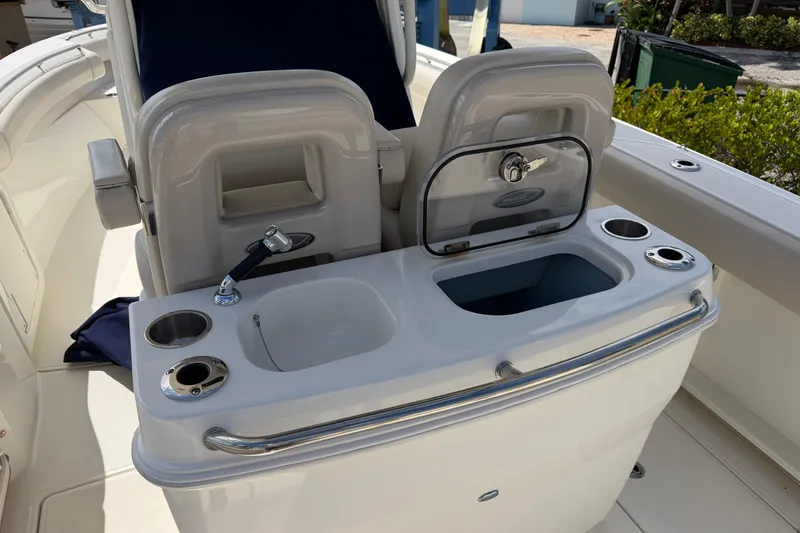 Slide: The Image of 2019 Boston Whaler 280 Outrage boat interior with sink and seating area. - 19