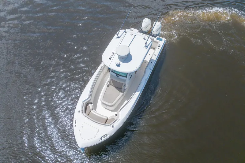 Slide: The Image of 2019 Boston Whaler 280 Outrage cruising on calm waters, aerial view. - 7
