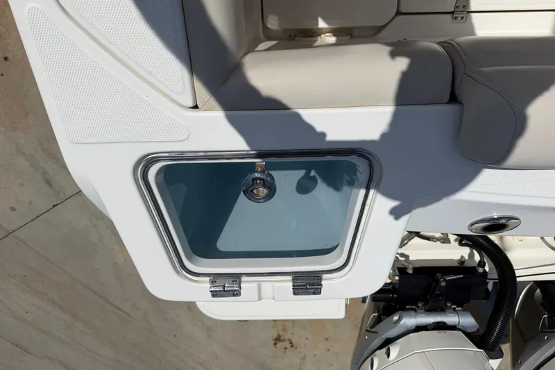 Slide: The Image of 2019 Boston Whaler 280 Outrage boat interior with storage compartment and seating. - 22