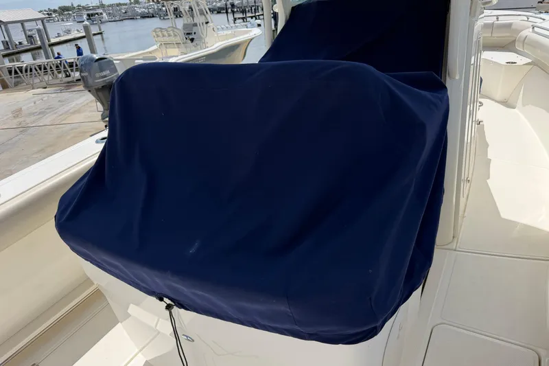 Slide: The Image of 2019 Boston Whaler 280 Outrage with covered console at marina. - 24