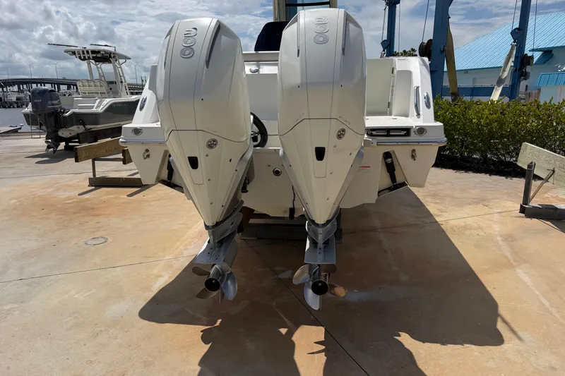 Slide: The Image of 2019 Boston Whaler 280 Outrage with dual outboard engines on display. - 3