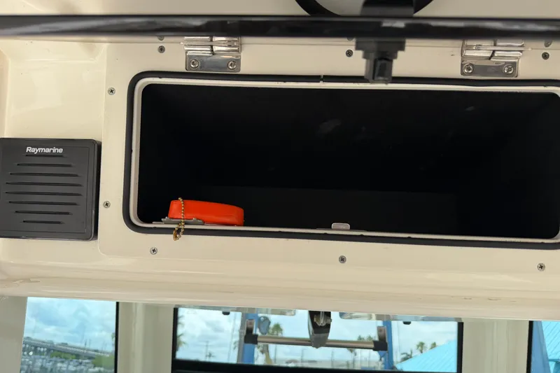 Slide: The Image of Storage compartment on a 2019 Boston Whaler 280 Outrage boat with Raymarine equipment. - 35