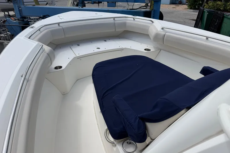 Slide: The Image of 2019 Boston Whaler 280 Outrage boat interior with cushioned seating and stainless steel railings. - 36
