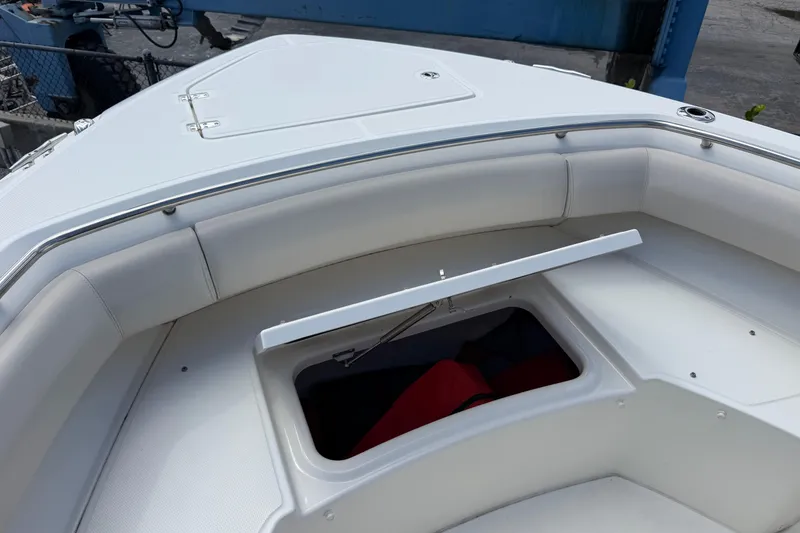 Slide: The Image of 2019 Boston Whaler 280 Outrage boat with open storage compartment on deck. - 38