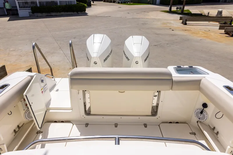 Slide: The Image of 2019 Boston Whaler 280 Outrage boat with twin Mercury engines at dock. - 16