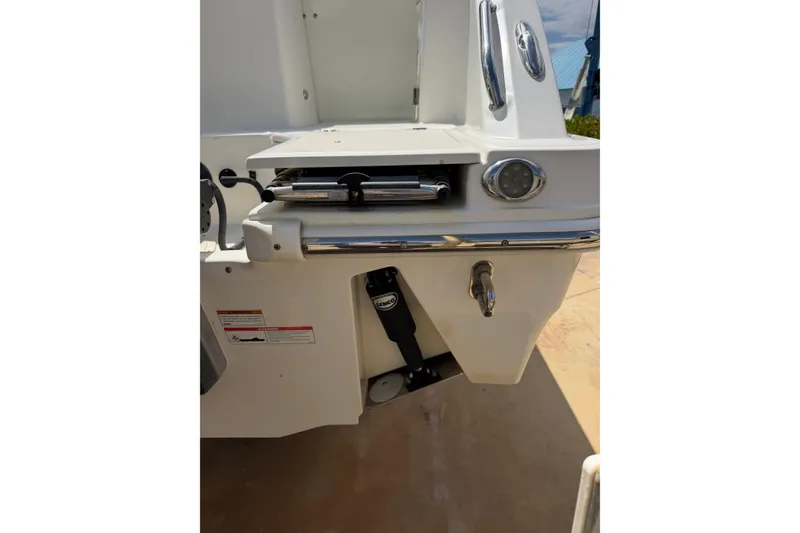 Slide: The Image of 2019 Boston Whaler 280 Outrage boat stern with trim tab and stainless steel fittings. - 4