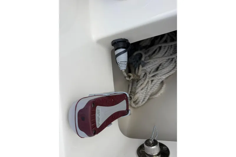 Slide: The Image of Storage compartment on a 2019 Boston Whaler 280 Outrage with rope and equipment. - 40