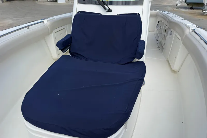 Slide: The Image of 2019 Boston Whaler 280 Outrage boat interior with blue cushioned seating. - 42