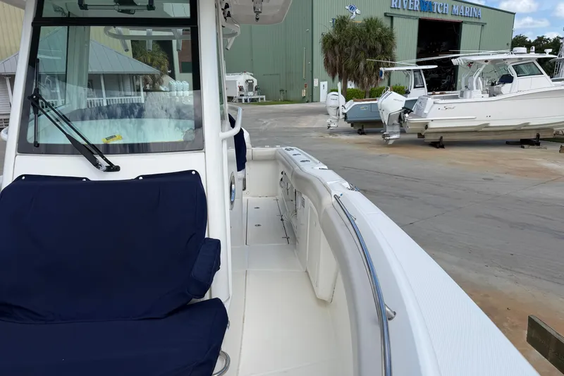 Slide: The Image of 2019 Boston Whaler 280 Outrage at Riverwatch Marina, featuring spacious seating and sleek design. - 44
