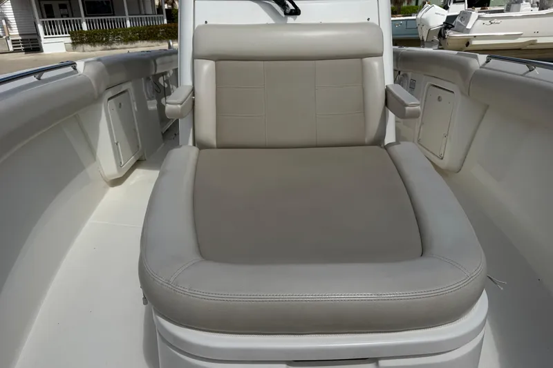 Slide: The Image of 2019 Boston Whaler 280 Outrage boat seat, featuring comfortable beige upholstery. - 46