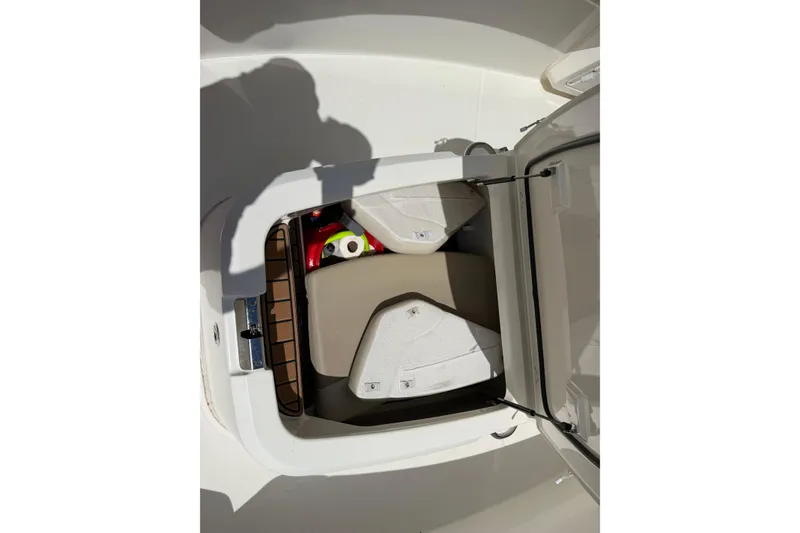 Slide: The Image of Storage compartment of a 2019 Boston Whaler 280 Outrage boat, featuring cushioned seating. - 47
