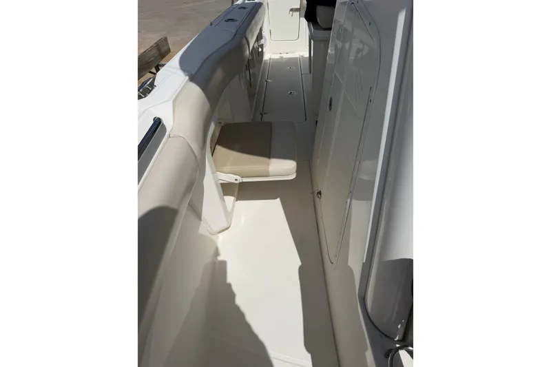 Slide: The Image of 2019 Boston Whaler 280 Outrage interior with seating and storage compartments. - 49