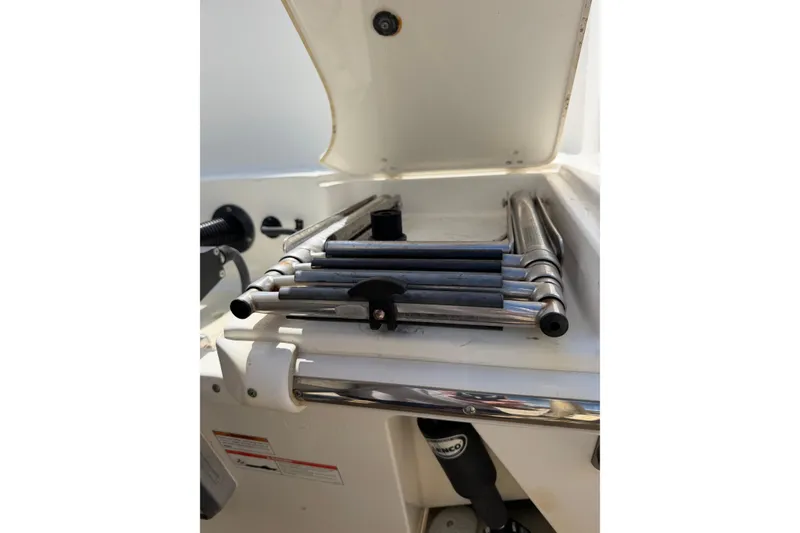 Slide: The Image of Folded ladder on a 2019 Boston Whaler 280 Outrage boat. - 5