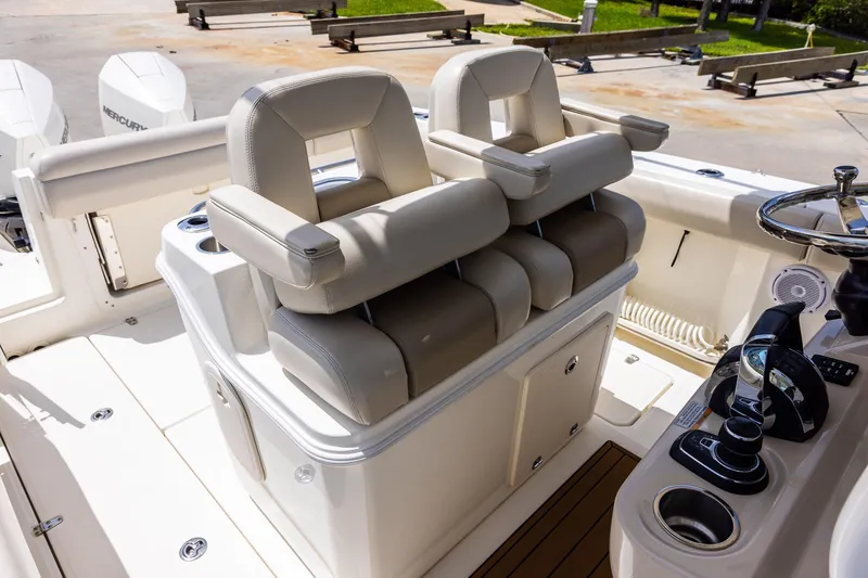 Slide: The Image of 2019 Boston Whaler 280 Outrage helm with dual seats and control panel. - 9