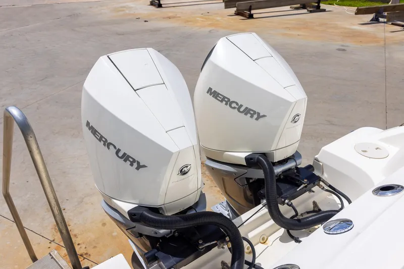 Slide: The Image of Twin Mercury outboard engines on a 2019 Boston Whaler 280 Outrage boat. - 37