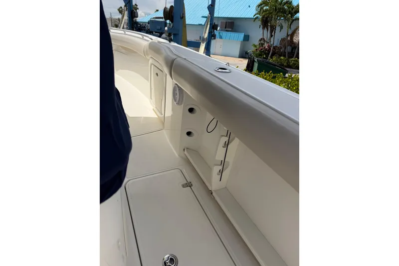Slide: The Image of 2019 Boston Whaler 280 Outrage boat interior with storage compartments and sleek design. - 8